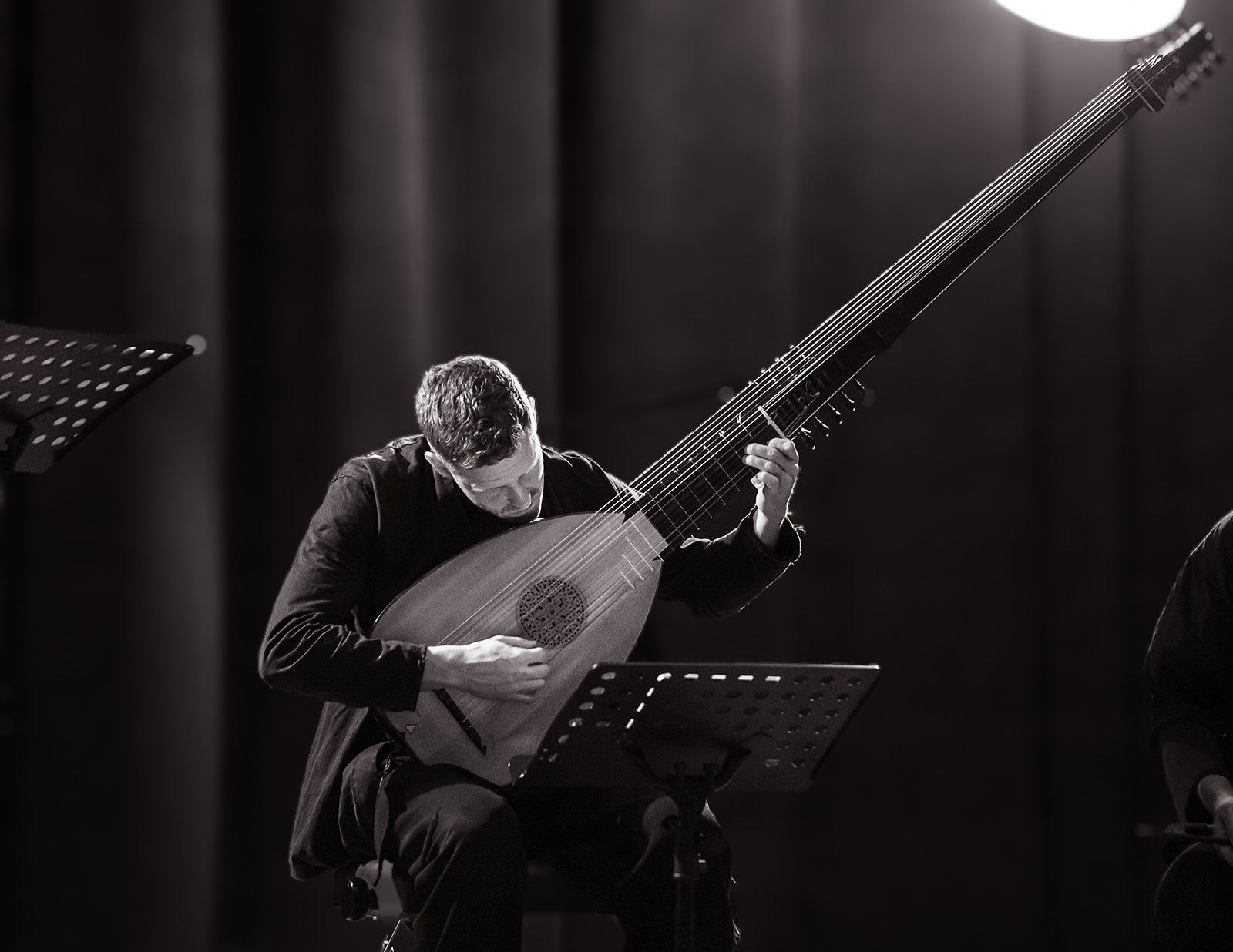 Black and white: Jonas Nordberg bent over the lute