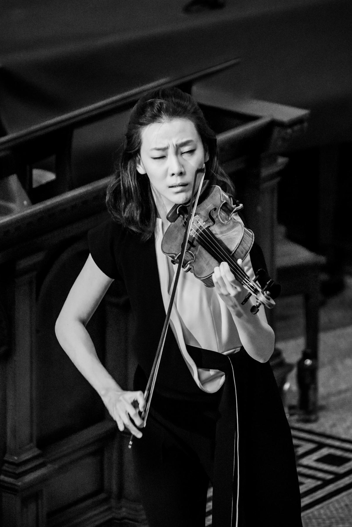 Black and white: Clara-Jumi Kang, eyes closed, bow on the string