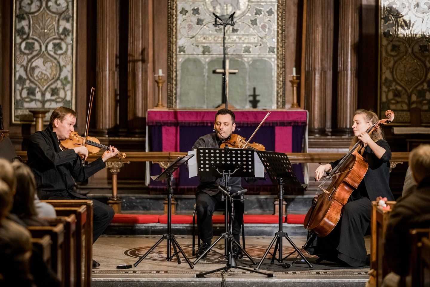 Maxim Rysanov, Nikita Boriso-Glebsky and Dóra Kokas performing before the altar of St Ann's Church