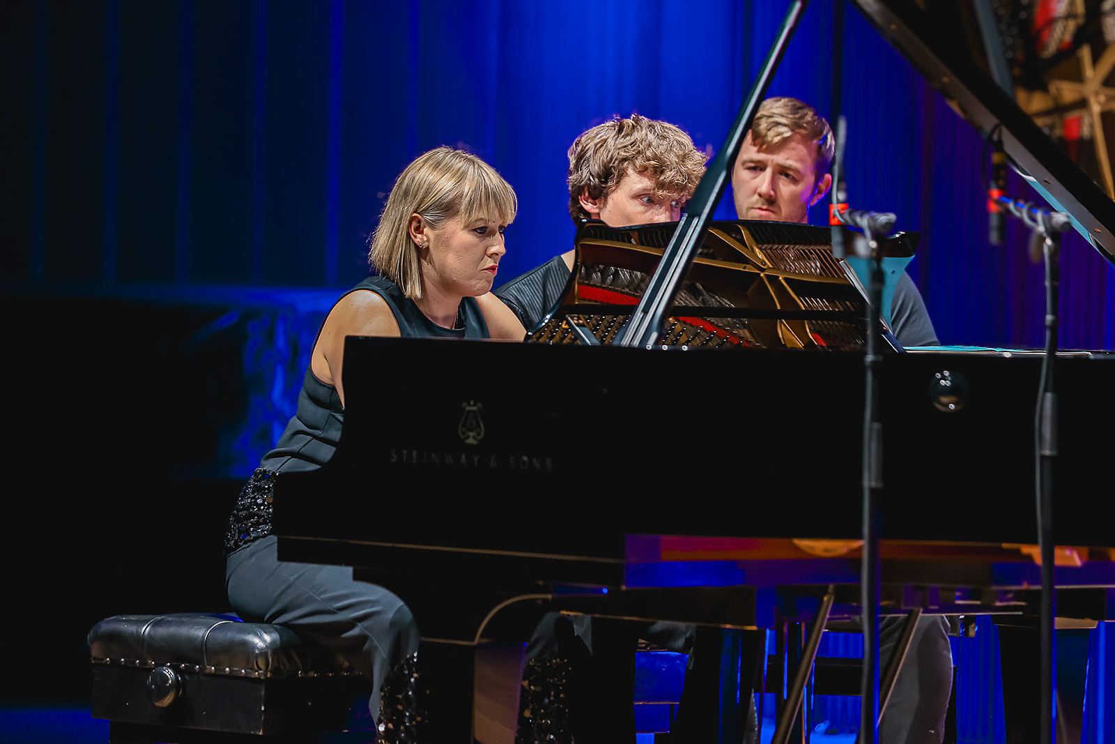 Close at the piano in blue light