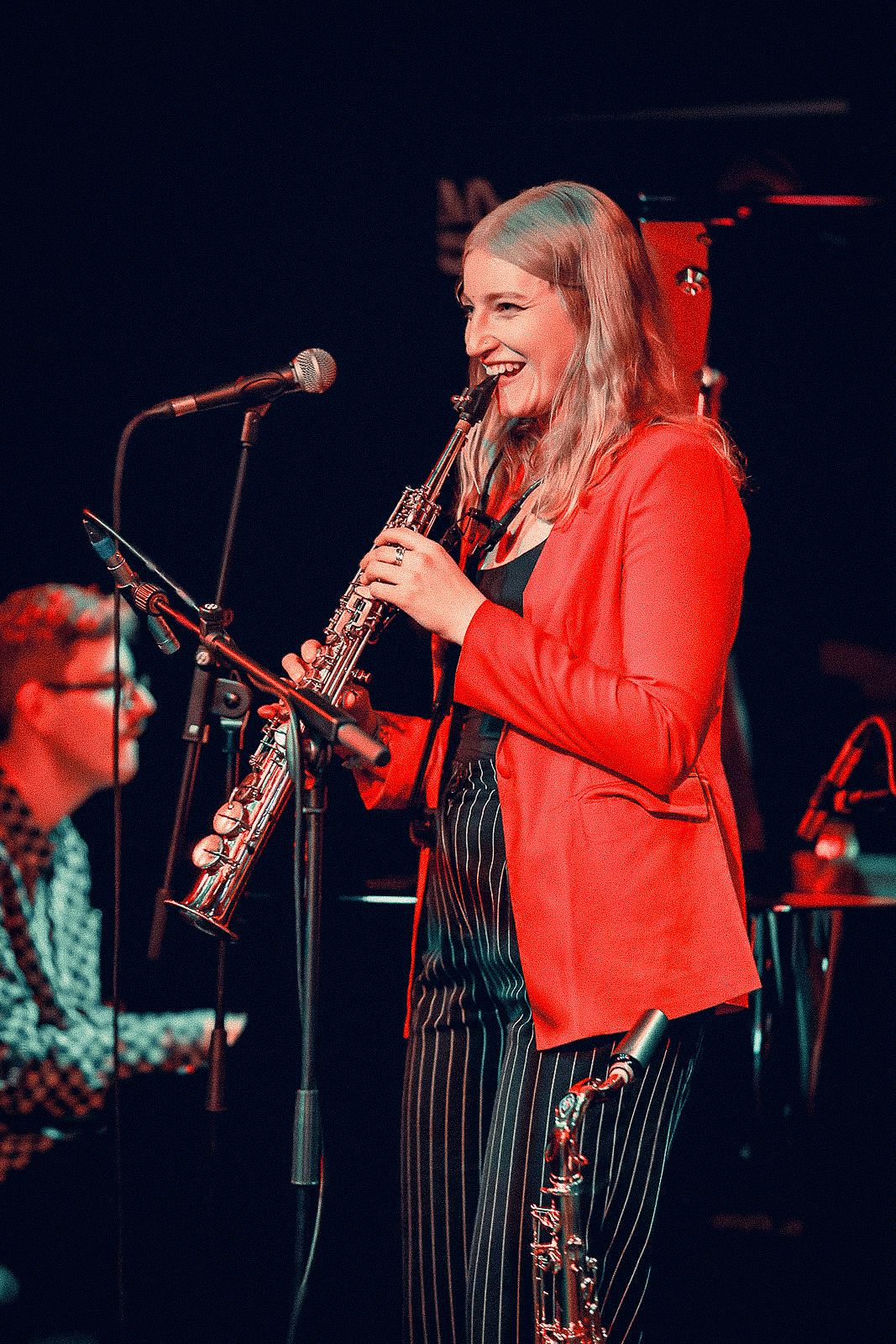 Soprano saxophone, the band around her