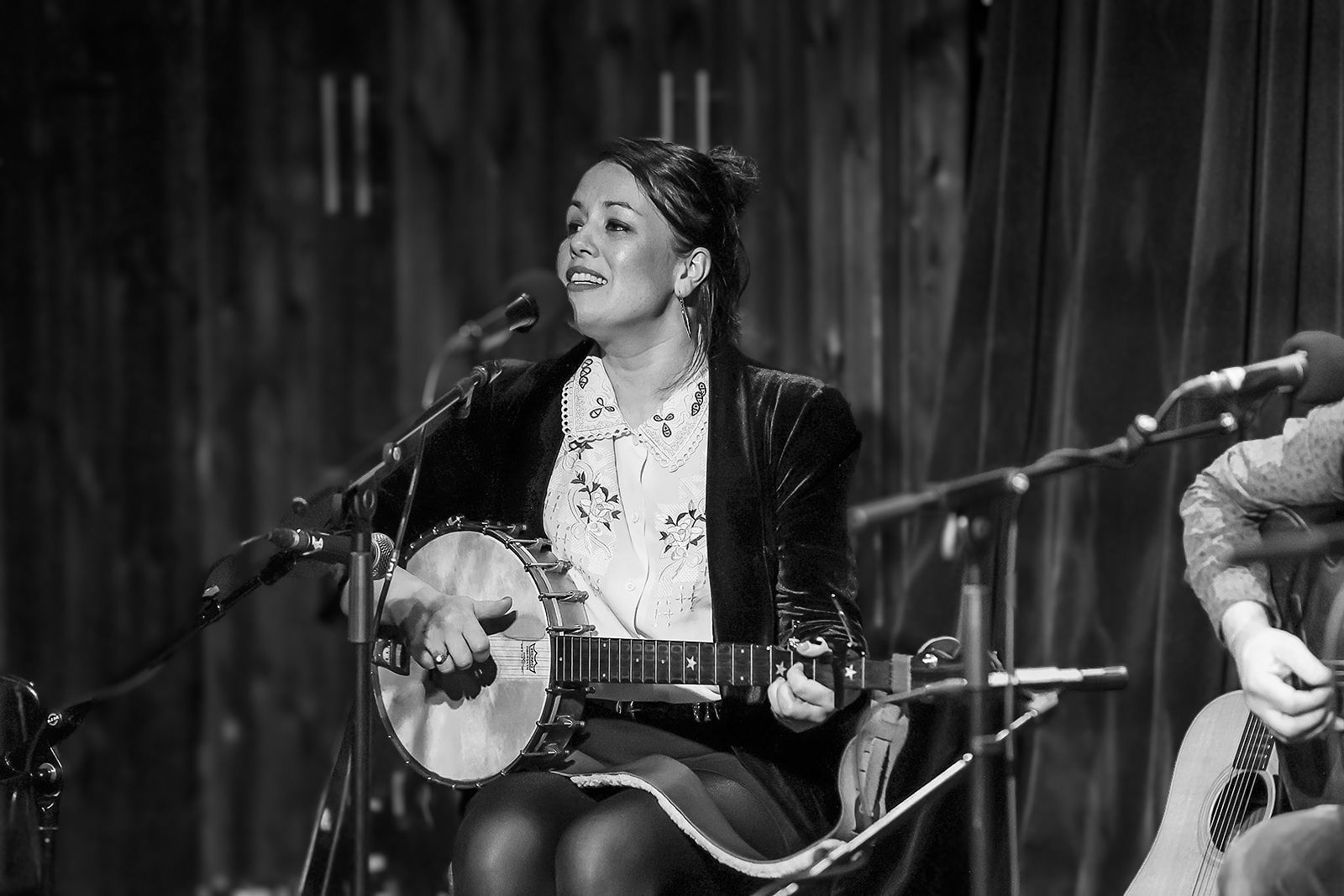 Black and white: Noriana Kennedy singing with her banjo