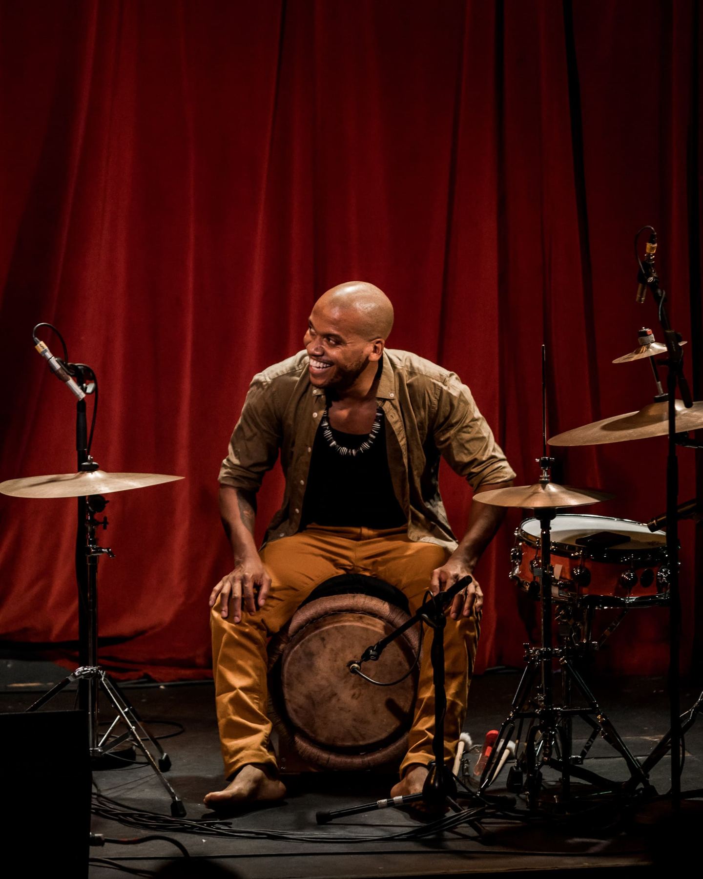 Boris Reine-Adélaïde playing a hand drum