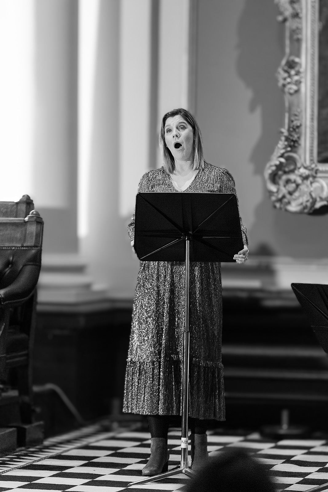 Black and white: Alison Langer singing on the chequered floor of the hall