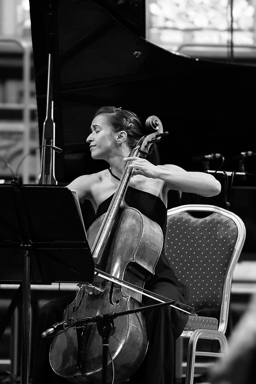 Black and white: Trio Bohémo's cellist playing beside the piano